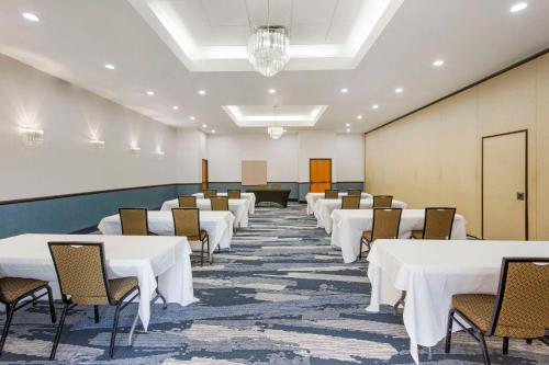 a row of tables and chairs in a room at Comfort Suites Ogden Conference Center in Ogden