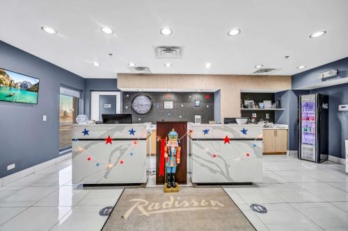 a lobby with a race car on display in a room at Radisson Hotel Schaumburg in Schaumburg