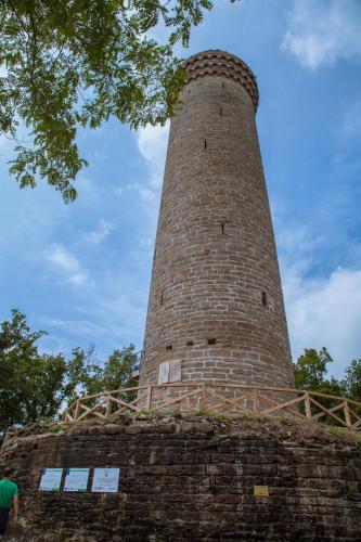 a brick tower on top of a brick wall at Peter Pan in Castellino Tanaro