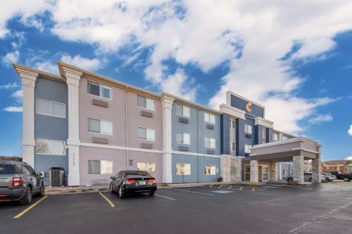 a large building with cars parked in a parking lot at Comfort Inn & Suites Oklahoma City North - Quail Springs in Oklahoma City