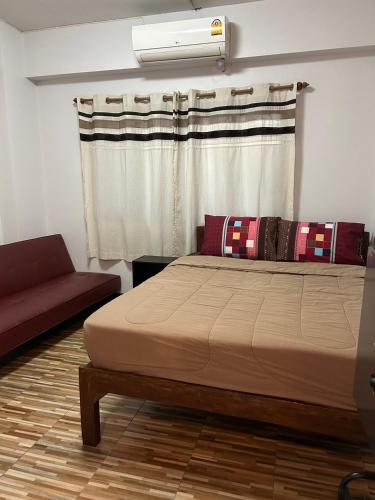 Chiangmai HomeTeLにあるベッド