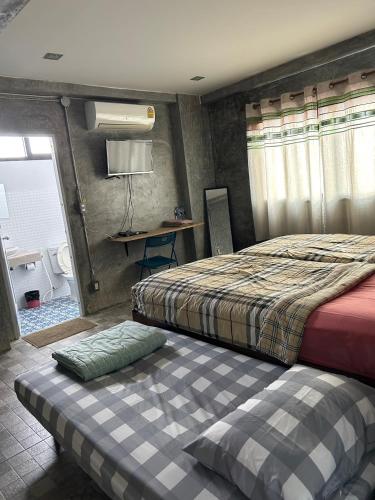 Chiangmai HomeTeLにあるベッド