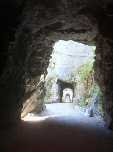 a tunnel in a cave with a person walking through it at Evergreen Bed & Breakfast in Hope