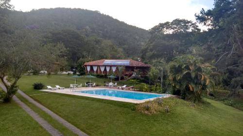 Bazén v ubytování Pousada Tucano Do Cuiabá nebo v jeho okolí