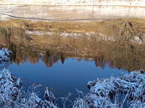 a body of water with snow on the ground at Holiday Home Moldava in Moldava