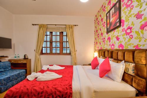 Resort Martins Siesta , A Portuguese Heritage Resort in Calanguteにあるベッド