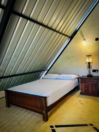 a bedroom with a bed in a tent at Eldorado Eco Glamping in Moragahamulla