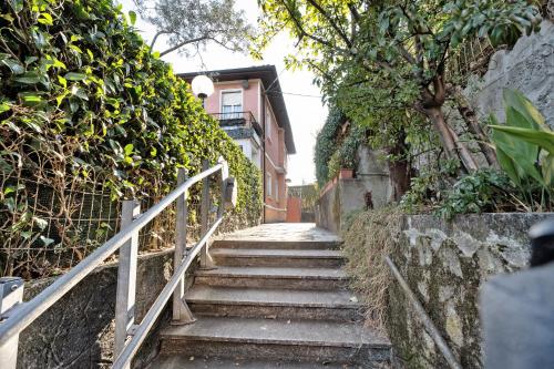 a set of stairs leading up to a building at Sunset on the Lake Belgirate in Belgirate
