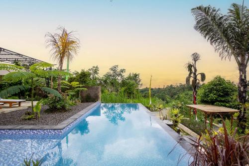 a swimming pool in a villa with a view at The Hidden Valley in Besakih
