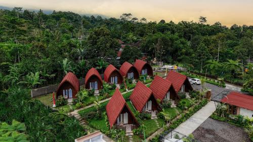 an overhead view of a row of houses with red roofs at The Hidden Valley in Besakih