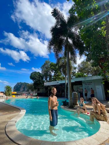 a man standing in the water at a swimming pool at Social Quarters Blanco - Youth Hostel 18 to 35 Only in Railay Beach
