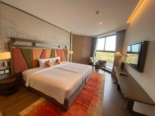 Katil atau katil-katil dalam bilik di Condotel Ocean View- Apec Mandala Mui Ne