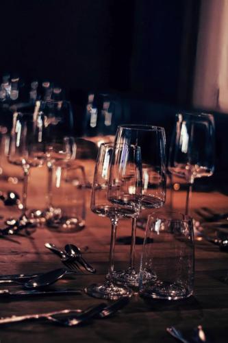 a group of wine glasses sitting on top of a table at Hotel Alpenkönig in Oberstaufen