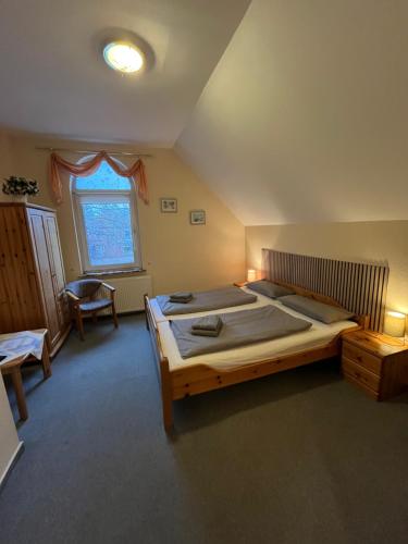 Postel nebo postele na pokoji v ubytování Hotel Mühleneck