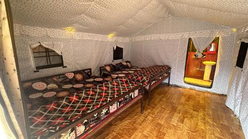 a room with a bunk bed in a tent at Adiyogi Campsite in Sari