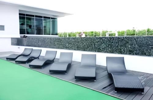 a waiting area in a hospital with chairs at Maritime Suites Penang in Jelutong