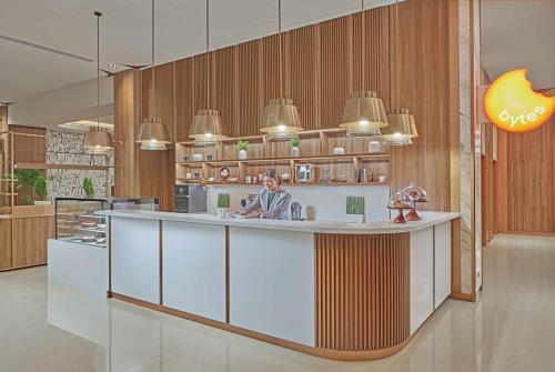 a kitchen with a island in the middle of a room at Lanson Place Mall of Asia Manila in Manila