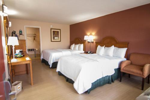 Postel nebo postele na pokoji v ubytování La Copa Hotel