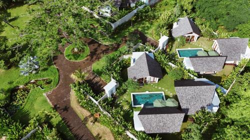 an aerial view of a house with a swimming pool at Arpana Luxury Private Pool Villas in Jimbaran