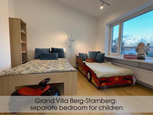 a bedroom with a bed and a toy car on the floor at Grand Villa Berg-Starnberg For Your Vacation, Retreat, Workshop, Corporate and Familys event in Berg am Starnberger See