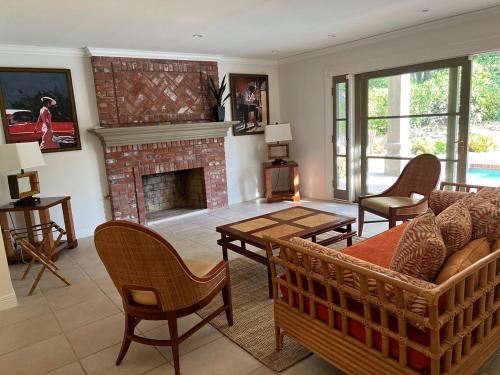 a living room with a couch and a fireplace at Porter Paradise in Deer Lake Highlands