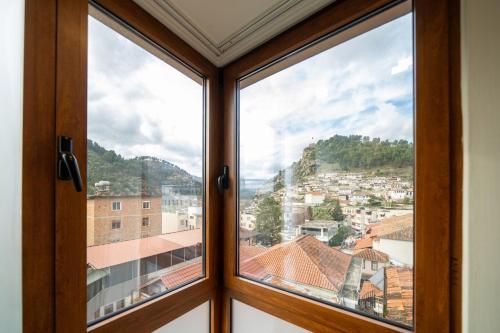 a window with a view of a city at MERKO HOTEL in Berat
