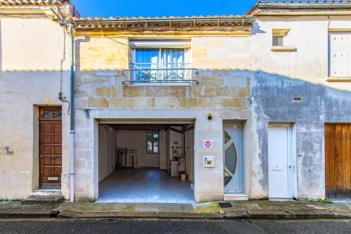 an entrance to a building with a garage at Sur La Route Des Vins - Libourne in Libourne