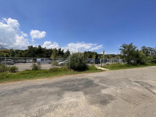 an empty parking lot with cars in a parking lot at Appartement cosy avec wifi en bord de mer in Poggio-Mezzana