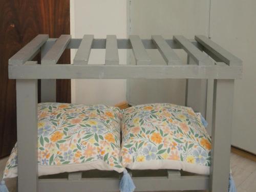 a white bunk bed with two pillows on it at Barn Guesthouse in Kroonstad