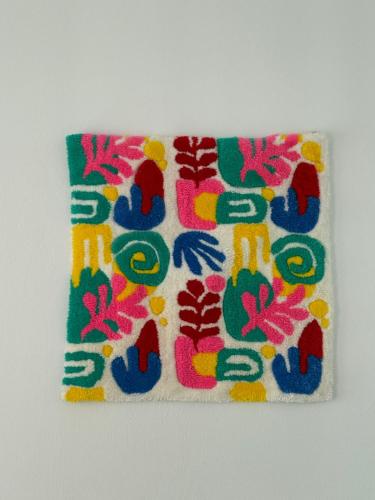 a towel with a colorful pattern on it at Urla The Orange House in Kuscular