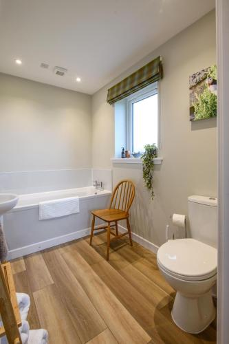 a bathroom with a toilet and a sink at Armadale Farm Cottage in Armadale