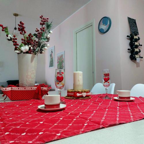 a red table cloth on a table with a red table cloth at Villa MARGHERITA in Pratola Peligna