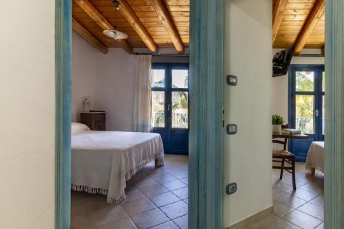 En eller flere senge i et værelse på Residenza Melissa