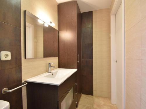 a bathroom with a sink and a mirror at Flores in Begur