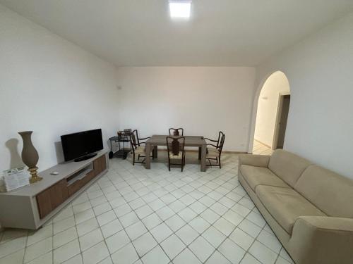 a living room with a couch and a table at Triscina 83 in Triscina