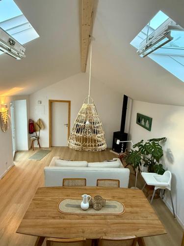 a living room with a couch and a table at Palmeirinha Guest House in Sintra