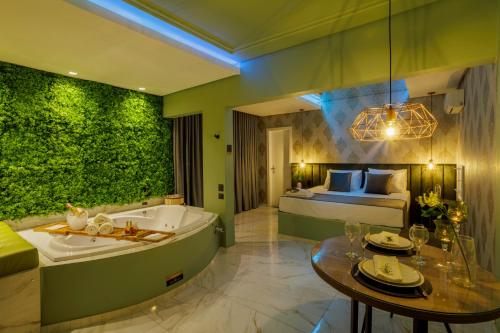 a bathroom with a tub and a bedroom with a bed at Medieval Motel SPA - Porto Alegre-RS in Porto Alegre