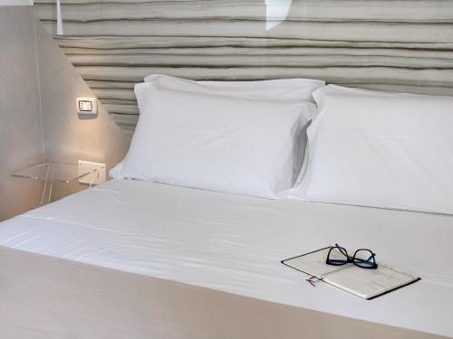 Una cama o camas en una habitación de San Pietro Home