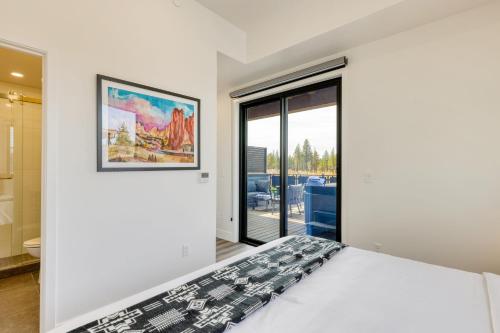 a bedroom with a bed and a large window at The Aerie Suites by AvantStay Modern Comfort with Mountain Views in Bend