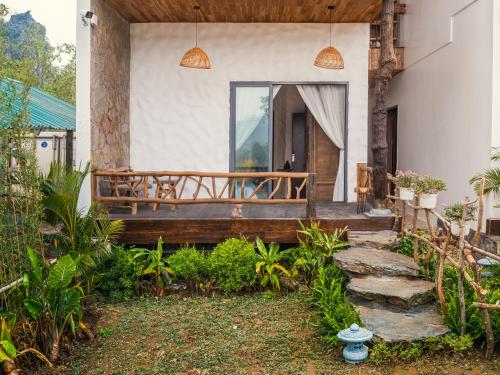 a porch of a house with a wooden deck at Ailee Villa&Hotel TamCoc in Ninh Binh