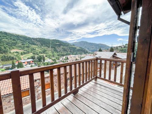 a balcony with a view of a city at Encant muntanyès, casa amb vistes a Martinet in Martinet