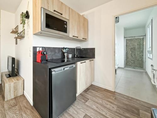 Кухня или мини-кухня в Charming Studio Disneyland Paris - Rentaway BnB
