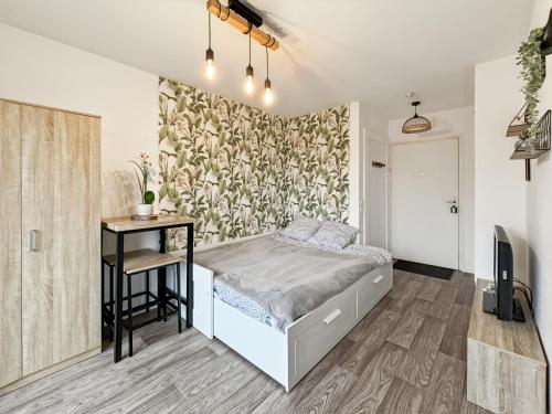 Кровать или кровати в номере Charming Studio Disneyland Paris - Rentaway BnB
