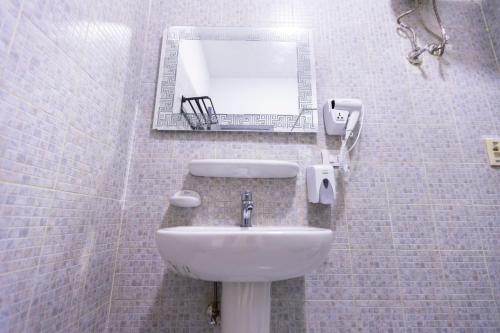 a bathroom with a sink and a mirror at Lazur Pool Apartment's - El Kawsar, Hurghada - Egypt in Hurghada