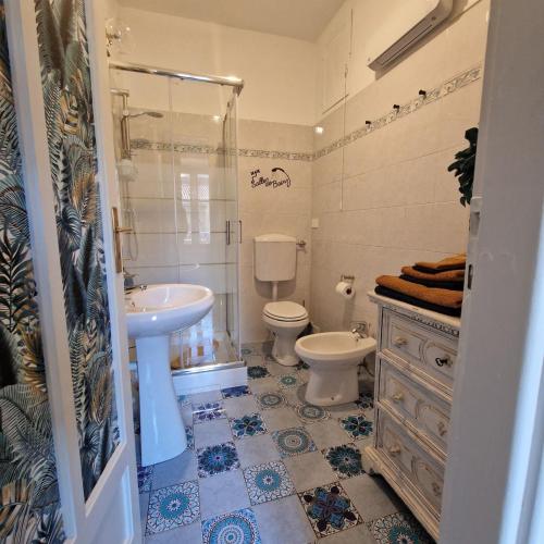 a bathroom with a sink and a toilet and a shower at Casa Gran Madre in Turin