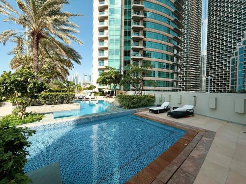 a swimming pool in the middle of a building at Beautiful 2 BR Apartment next to Opera I Burj View in Dubai