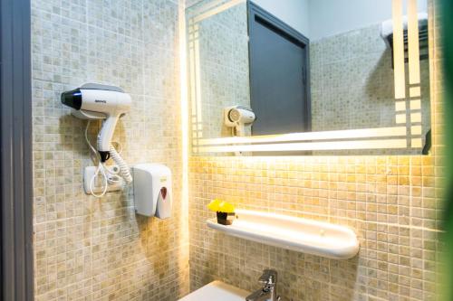 a bathroom with a sink and a mirror at Lazur Pool Apartment's - El Kawsar, Hurghada - Egypt in Hurghada