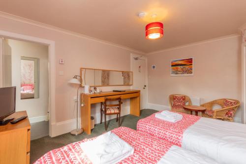 Ένα ή περισσότερα κρεβάτια σε δωμάτιο στο The Ardyne Guest House