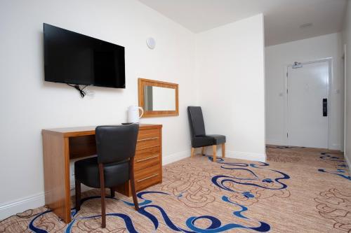 Kelpies Hotel Falkirkにあるテレビまたはエンターテインメントセンター