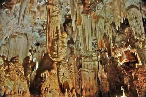 a cave filled with lots of rock formations at Jardines de Viana in Viana